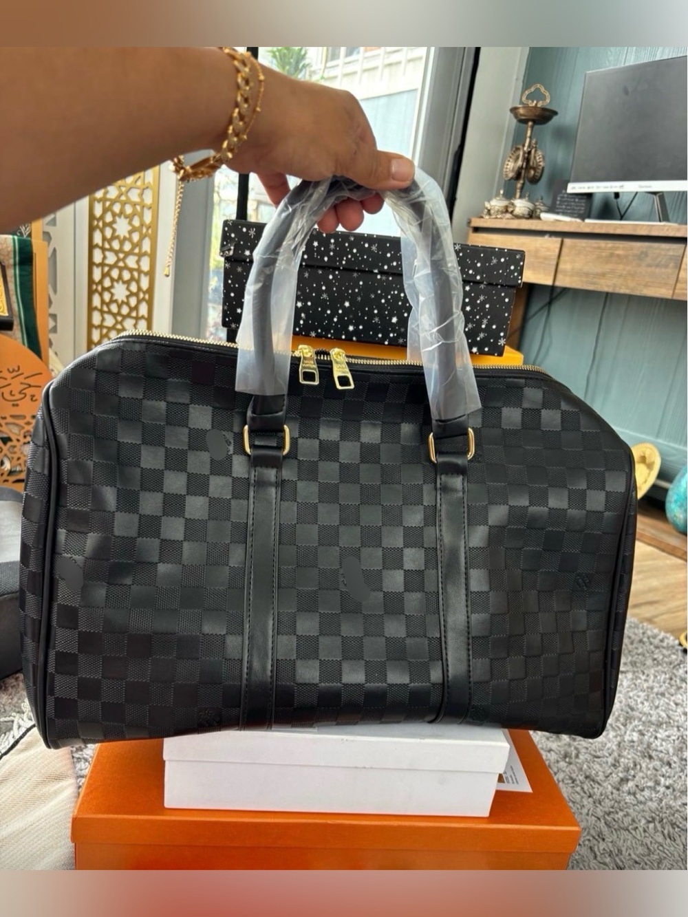 Classic Black Checkered Duffel Bag with Gold Hardware